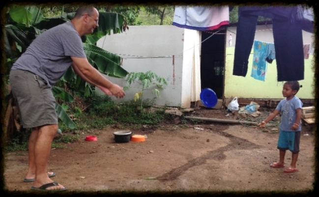 John Playing frisbee with boy