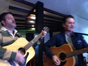 Our friend Marvin and one of his friends singing to us our first week here!!