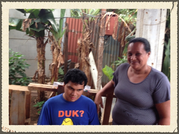 Mother and son at food distribution