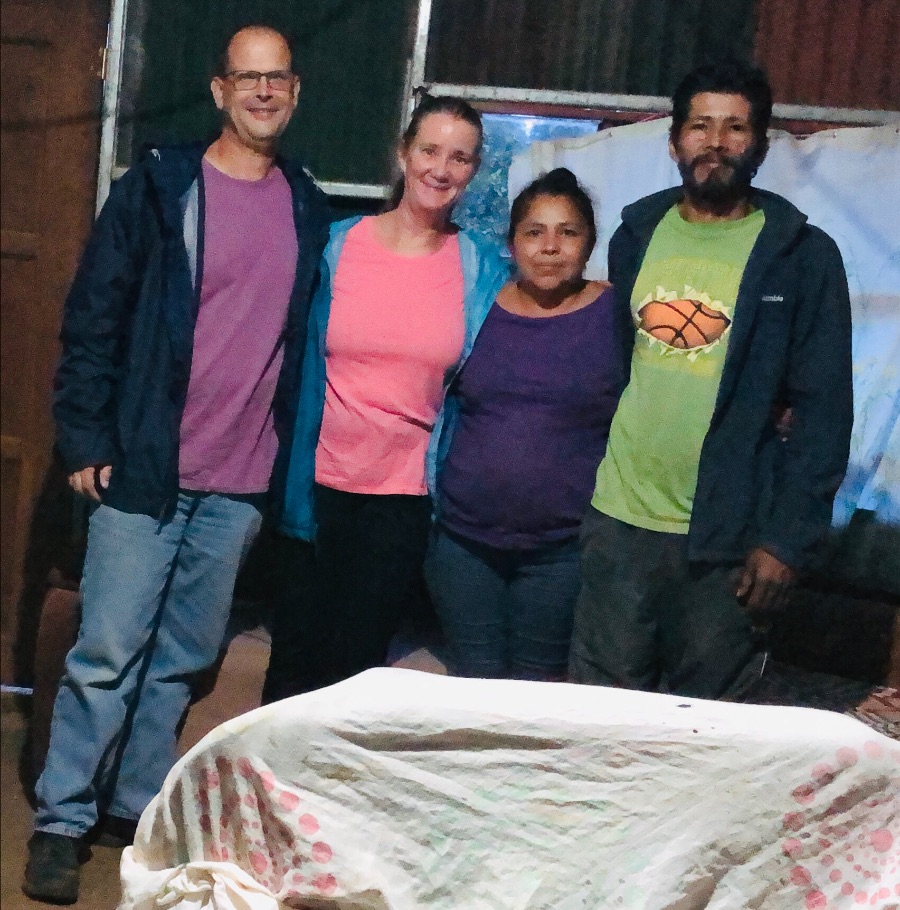 John teaching some of the kids how to make tortillas