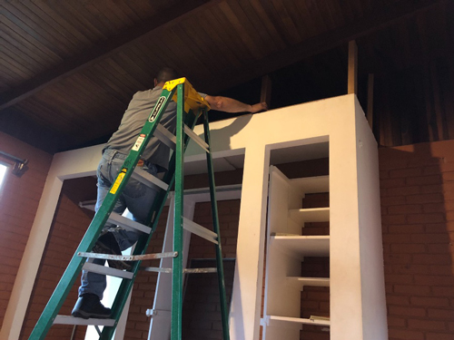 John using his handyman skills